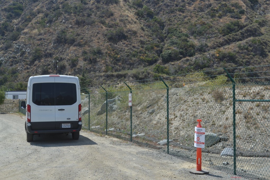The Fish Canyon shuttle van waiting for passengers at the trailhead stop.