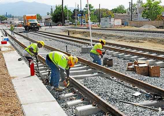 A 2014 file photo shows construction in Azusa on the Gold Line Extension, an example of Metro transit projects that bring both transportation benefits and jobs to the area. (Photo by Walt Mancini/Pasadena Star-News) 