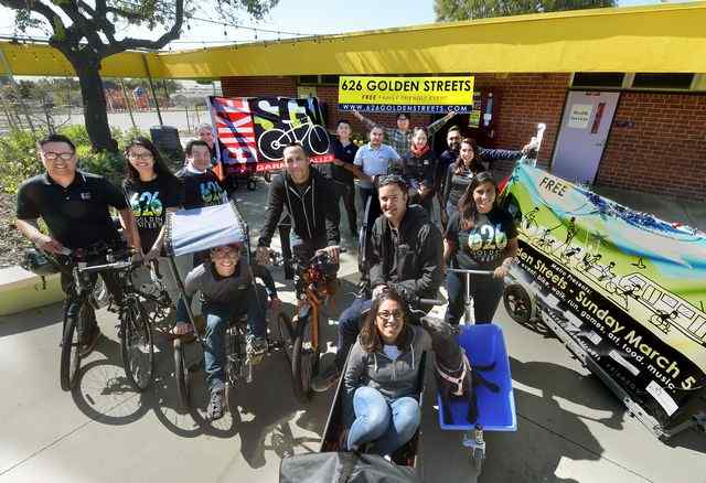 A team from Bike SGV takes a break from an organizational meeting at headquarters in El Monte on Feb. 24, 2017. On Sunday, March 5, the group will put on the 626 Golden Streets from South Pasadena to Azusa. Nearly 18 miles of streets will be car-free (streets closed from 9 a.m. to 3 p.m.) , so that people can walk, run and ride bicycles (non motorized vehicles) through the whole route. The event had to be postponed from last June due to wildfires in Duarte and Azusa. The event emphasizes bike and train riding and falls on the one-year anniversary of the opening of the Gold Line Foothill Extension. (Photo by Walt Mancini/Pasadena Star-News/SCNG) 